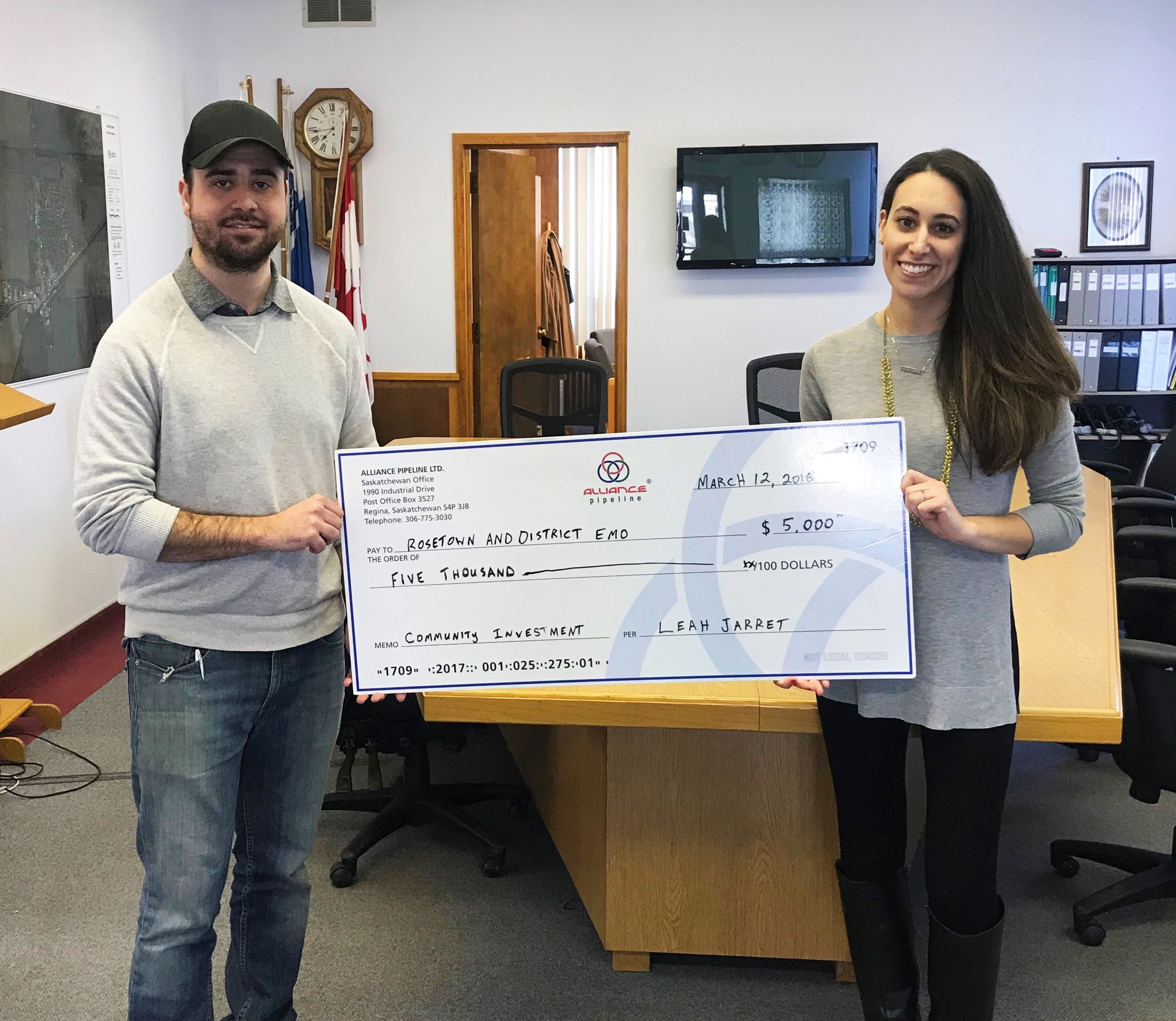 Image of Alliance representative and EMO representative with giant cheque